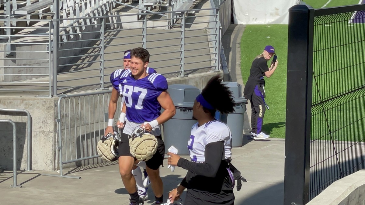Cade Otton arrives at practice.